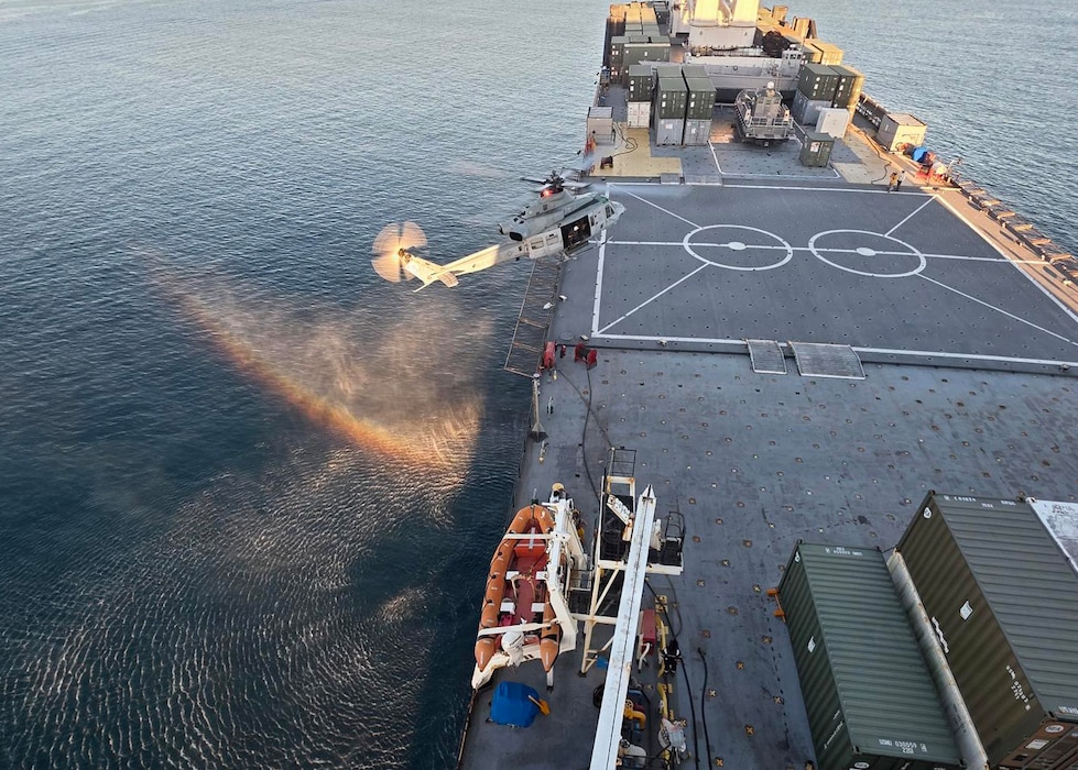 A U.S. Marine Corps UH-1Y Venom helicopters with Marine Light Attack Helicopter Squadron 367, Marine Aircraft Group 39, 3rd Marine Aircraft Wing, lands aboard Military Sealift Command’s prepositioning ship USNS Seay (T-AKR 302), during deck landing qualifications, at Kin Bay, Okinawa, Japan, June 22, 2026. (Courtesy photo)