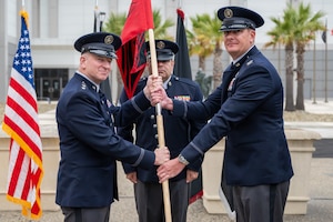 U.S. Space Force Lt. Gen. Dennis O. Bythewood, left, U.S. Space Forces-Space (S4S) commander and Combined Joint Force Space Component commander, passes the guidon to USSF Col. Samuel Opelaar, right, incoming Space Delta 5 commander, during a change of command ceremony at Vandenberg Space Force Base, Calif., June 18, 2026. Oppelaar assumes command of DEL 5 to lead its mission of delivering space effects to achieve theater and global objectives, managing the command-and-control functions presented to U.S. Space Command to accomplish the Combined Space Operations Center (CSpOC) mission. (U.S. Space Force photo by David Dozoretz)