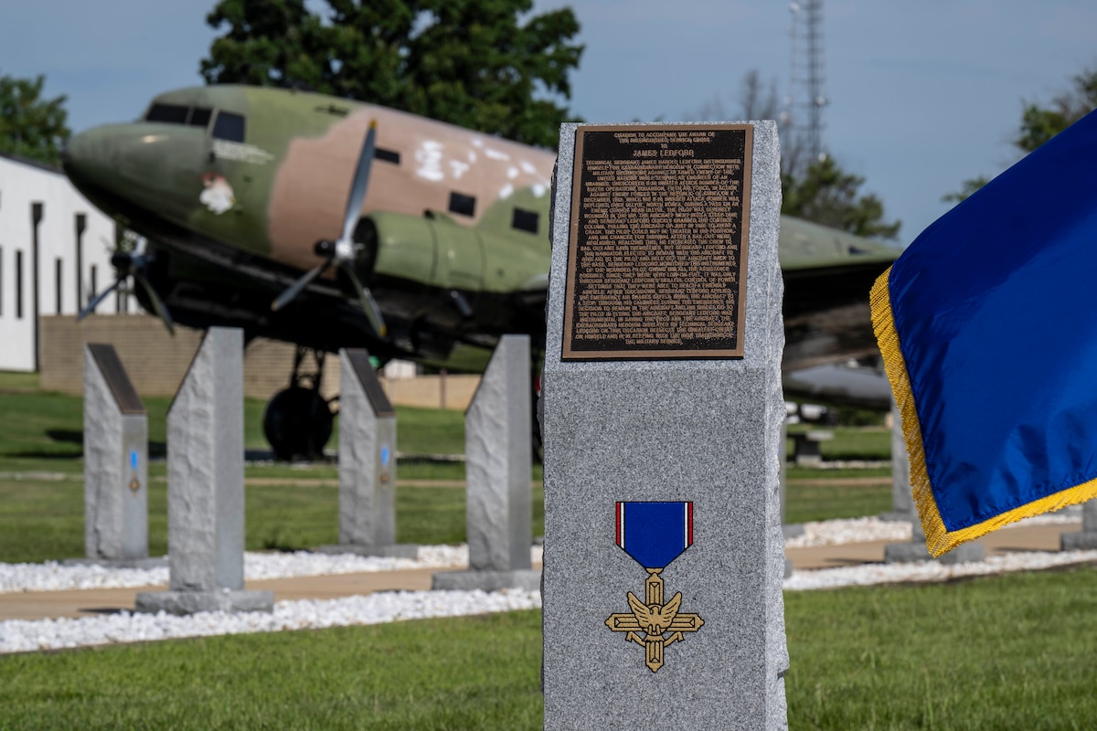 A new monument dedicated to Tech. Sgt. James H. Ledford stands at the Walk of Heroes, June 24, 2026. Ledford, a flight engineer on a B-26 Invader, earned the Distinguished Service Cross for saving his crew and aircraft on Dec. 8, 1952, after an antiaircraft shell severely wounded the pilot over North Korea. (U.S. Air Force photo by Brian Ferguson)