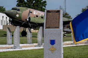 A new monument dedicated to Tech. Sgt. James H. Ledford stands at the Walk of Heroes, June 24, 2026. Ledford, a flight engineer on a B-26 Invader, earned the Distinguished Service Cross for saving his crew and aircraft on Dec. 8, 1952, after an antiaircraft shell severely wounded the pilot over North Korea. (U.S. Air Force photo by Brian Ferguson)
