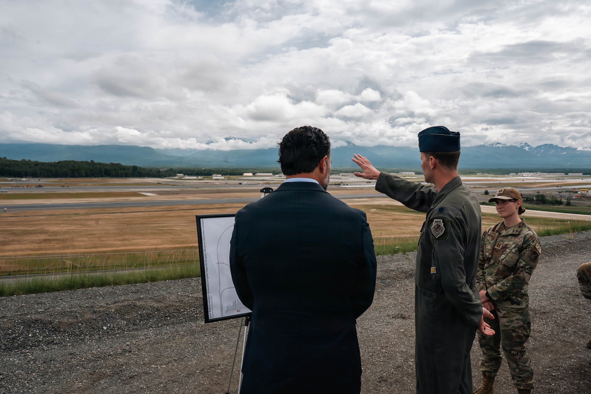 Under Secretary of the Air Force, Matt Lohmeier, discusses runway expansion plans with U.S. Air Force Lt. Col. Ryan Sivertsen, 3rd Wing chief of plans and programs, at Joint Base Elmendorf-Richardson, Alaska, June 22, 2026. Lohmeier toured the installation to meet with service members and assess Arctic operational readiness, strategic modernization plans and future infrastructure investments. (U.S. Air Force photo by Airman 1st Class Keola Vischi)