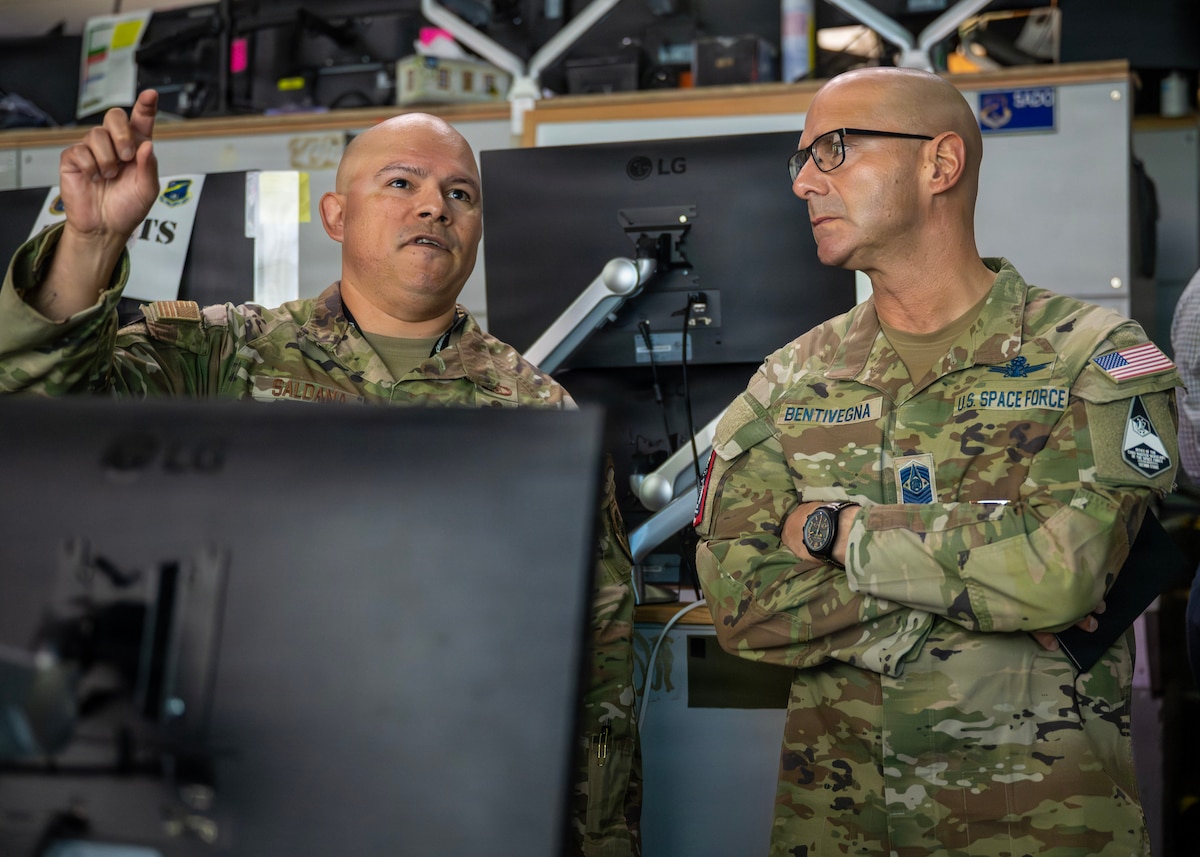 Chief Master Sgt. of the Space Force John Bentivegna, right, receives a facility tour at Osan Air Base, Republic of Korea, June 15, 2026. The tour highlighted joint and combined capabilities that enable synchronized multinational operations to support deterrence and readiness. (U.S. Air Force photo by Staff Sgt. Sarah Williams)