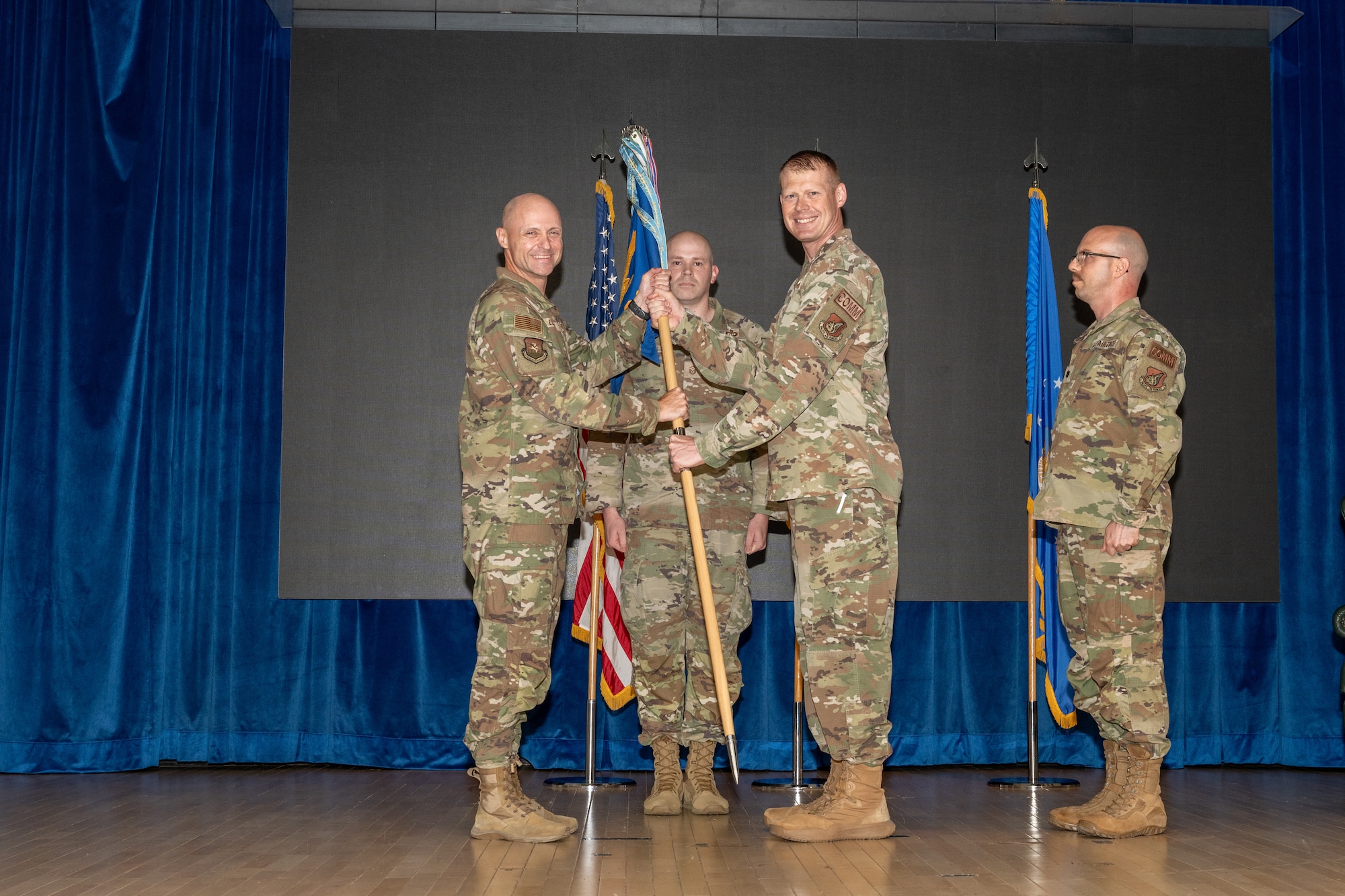 A commander relinquishes command of a squadron during a ceremony.