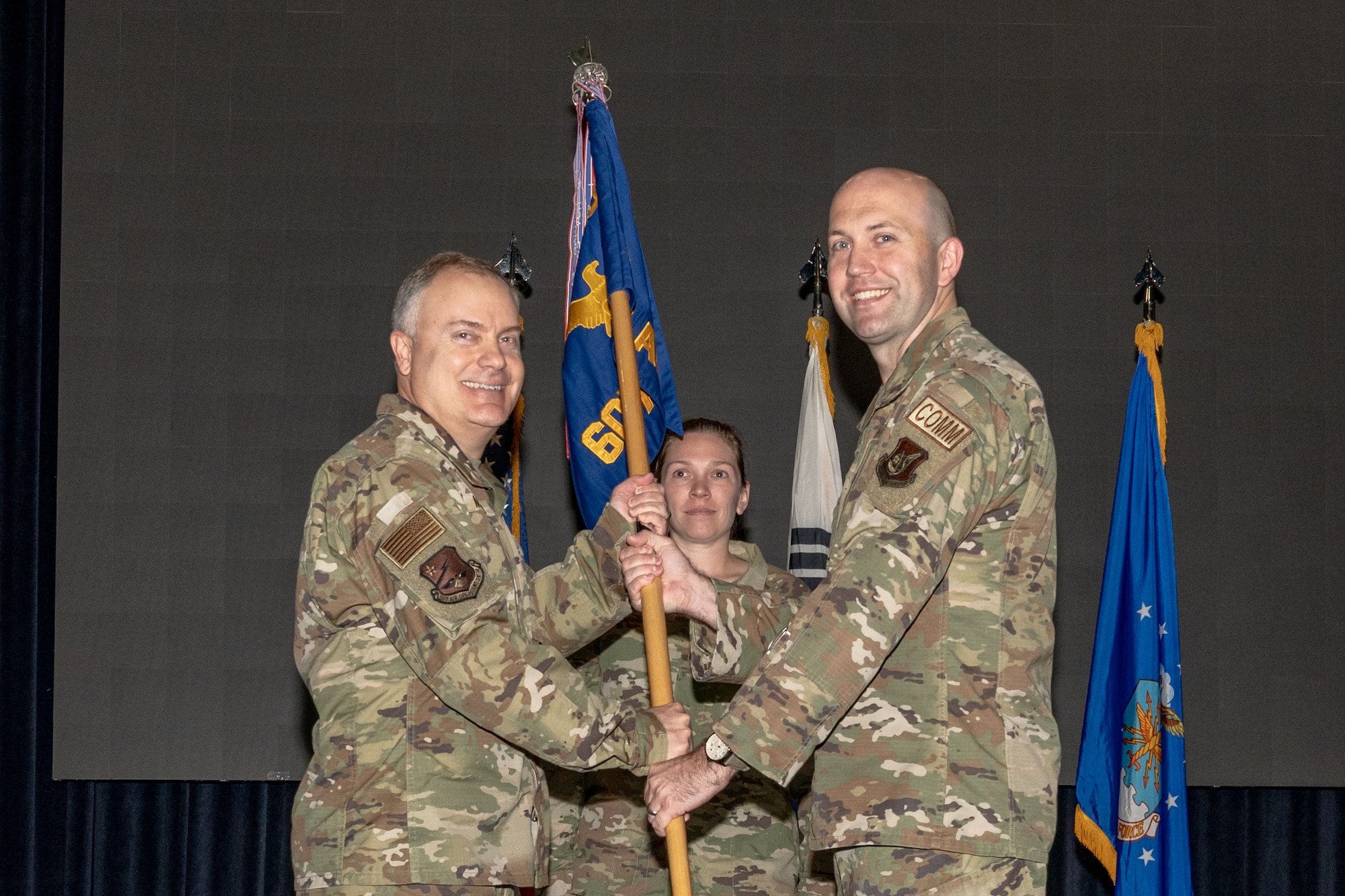 A commander accepts command of a squadron during a ceremony.