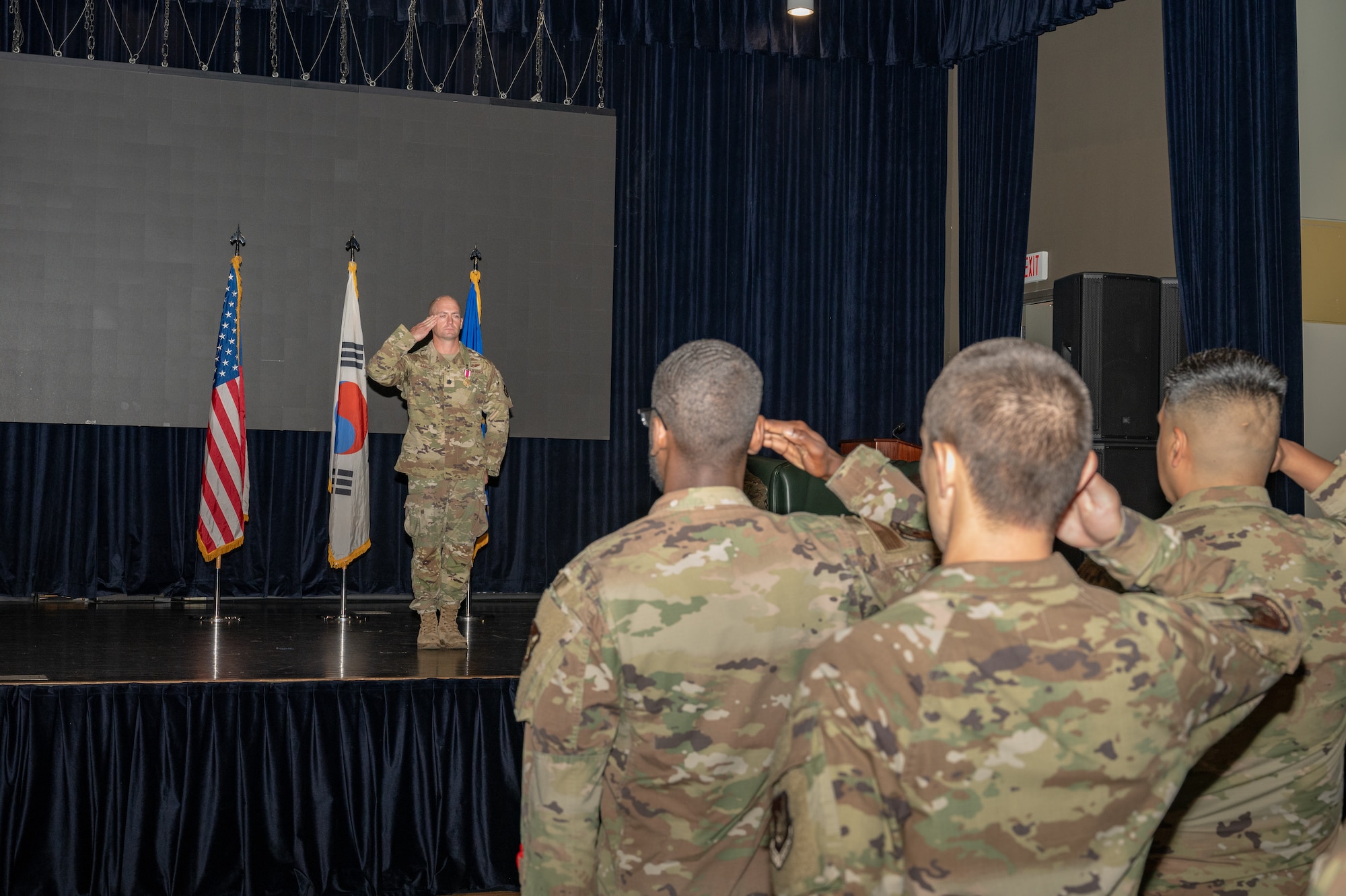 A commander salutes his squadron for the final time before relinquishing command.