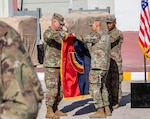 Maj. Gen. Jack James, left, and Command Sgt. Maj. Arnold Reyes, right, the 42nd Infantry Division command team, case the division's colors during the Task Force Spartan transfer of authority ceremony June 6, 2026, in the Middle East. The New York Army National Guard's 42nd Infantry Division headquarters served as the command for the Army's Middle Eastern combat element during Operation Epic Fury. Courtesy photo.