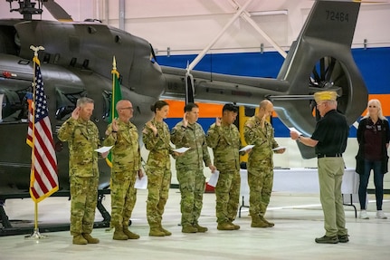 Soldiers from C Company, 1st Battalion, 112th Aviation Regiment take the oath to join the Wenatchee Valley Veterans of Foreign War chapter at the Army Aviation Support Facility 2, Pangborn Airfield in Wenatchee, Washington, June 17, 2026.