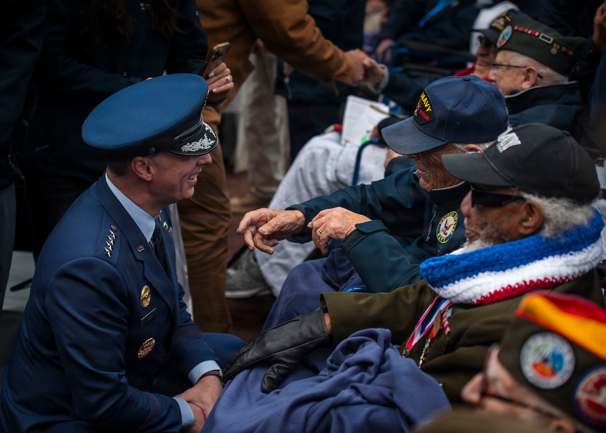 U.S. Air Force Gen. Dagvin R.M. Anderson, U.S. Africa Command seventh commander, greets World War II veterans at the Normandy American Cemetery during D-Day 82 near Omaha Beach, France, June 6, 2026. The sacrifices made by U.S. service members and our Allies during World War II serve as a reminder of the importance of solidarity in times of adversity. It is through our determination that we continue to uphold the principles of freedom and democracy for which so many valiantly fought to preserve. (U.S. Air Force photo by Staff Sgt. Sabrina Fuller-Judd)