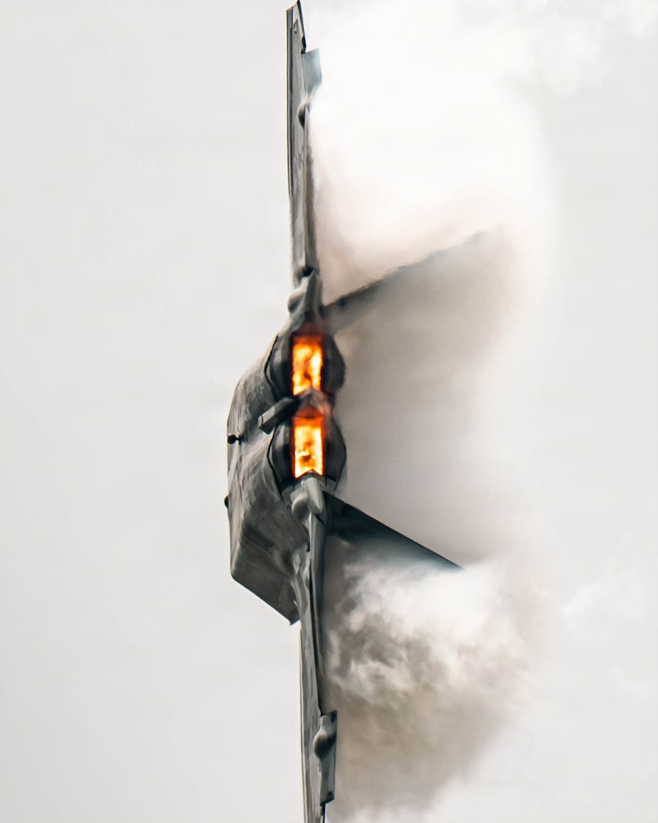 U.S. Air Force Capt. Nick “Laz” Le Tourneau, pilot and commander of the F-22 Raptor Aerial Demonstration Team, performs an aerial demonstration during the Dayton Airshow in Vandalia, Ohio, June 14, 2026. The F-22 is designed to perform high-performance maneuvers that showcase its maneuverability and control in flight. The visible vapor forms when rapid changes in air pressure and humidity around the aircraft cause water vapor in the air to condense. (U.S. Air Force photo by Staff Sgt. Mary Bowers)