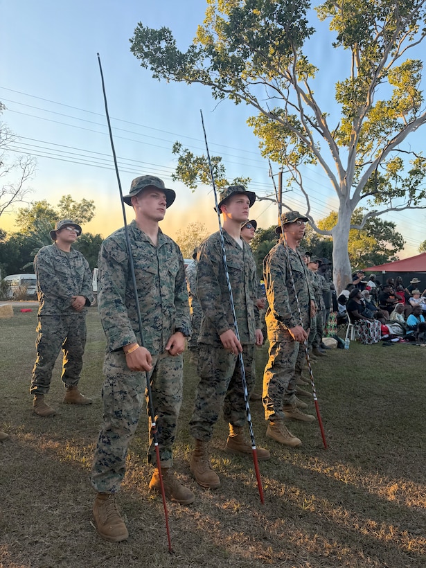 U.S. Marines with Marine Rotational Force – Darwin 26 hold spears gifted to them by Esther Bulumbara, the senior traditional owner of Bagala clan lands, at the Barunga Festival 2026 closing ceremony in Barunga, Northern Territory, Australia, June 7, 2026. MRF-D is a six-month forward deployment in Australia that strengthens combined interoperability with the Australian Defence Force and provides rapid crisis-response options for the joint force across the Indo-Pacific. (U.S. Marine Corps photo by 1st Lt. Chase Fortier)