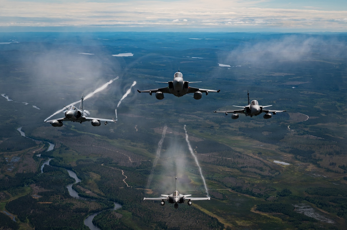 Military aircraft from the Czech Republic, Sweden and France, fly in a square formation over Finland during exercise Ramstein Flag, June 16, 2026. Ramstein Flag 2026 is a complex, large-scale, tactical level exercise which demonstrates NATO’s determination to counter modern and emerging threats through distributed operations. (U.S Air National Guard photo by Master Sgt. Sarah M. McClanahan)