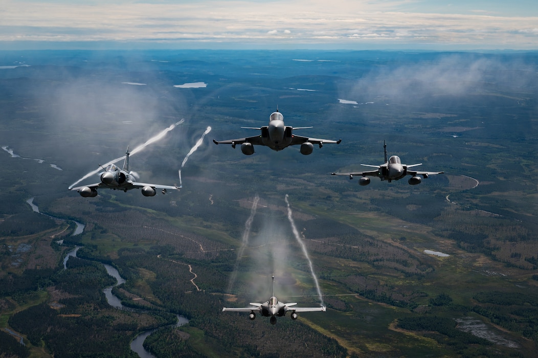 Military aircraft from the Czech Republic, Sweden and France, fly in a square formation over Finland.