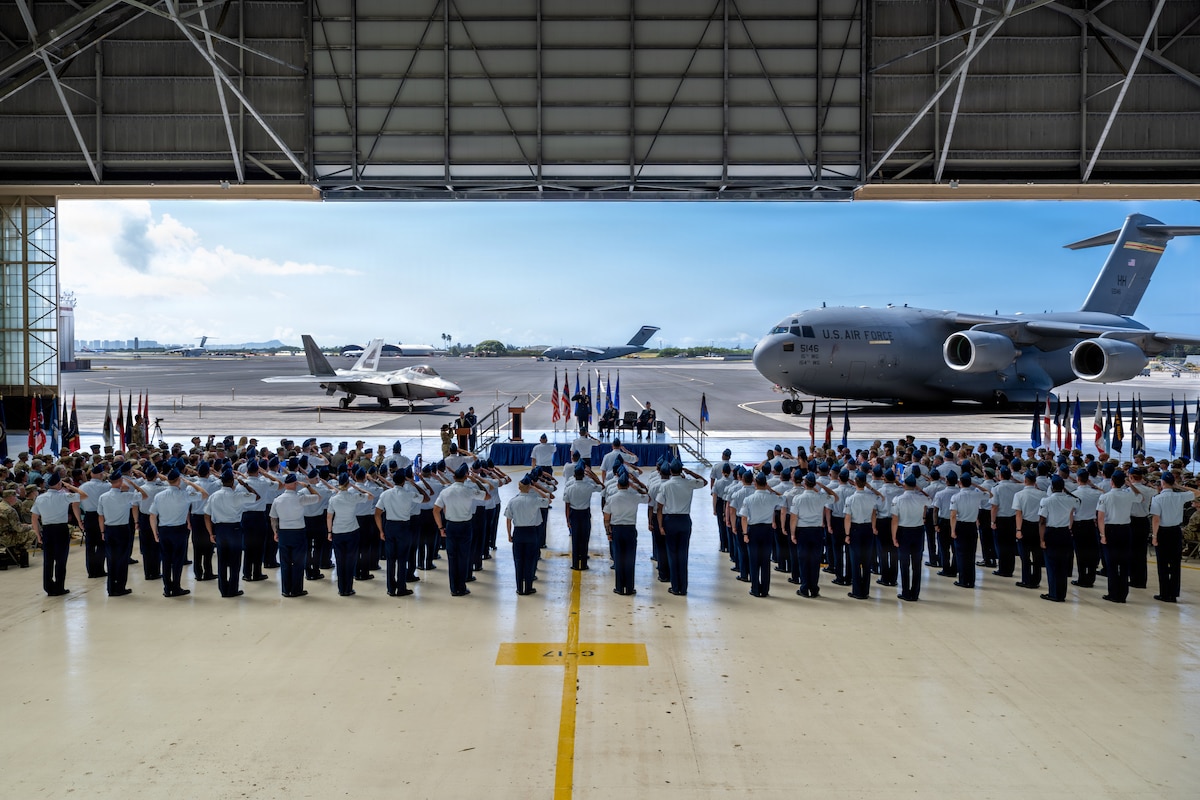 U.S. Air Force members of the 15th Wing render a first salute to Col. Kyle Clinton, incoming 15th Wing commander, during the wing change of command ceremony at Joint Base Pearl Harbor-Hickam, Hawaii, June 18, 2026. The salute represented the 15th Wing’s recognition of Clinton’s assumption of command. (U.S. Air Force photo by Staff Sgt. Shelby Rapert)