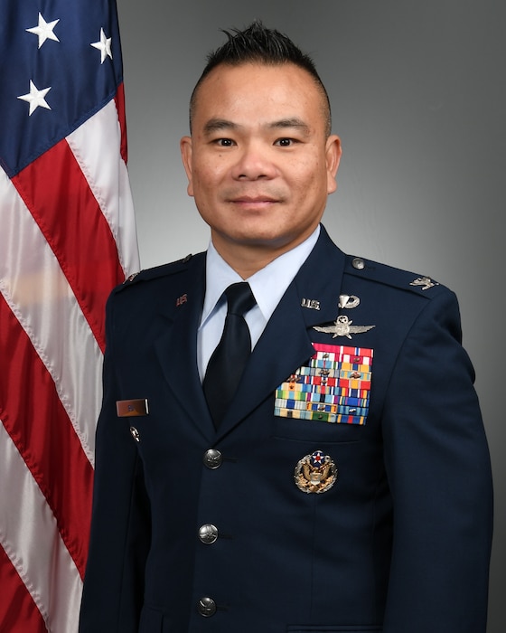 Service member poses for photo