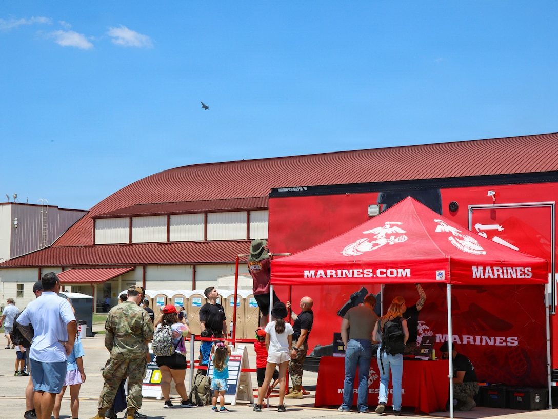U.S. Marines with Recruiting Station San Antonio, 8th Marine Corps District, participate in The Great Texas Airshow at Joint Base San Antonio in Randolph Air Force Base, Texas, May 2, 2026. The Great Texas Airshow brings in over 500,000 people daily over a three day period each year. San Antonio Marines utilized the pull-up bar and Flight Simulator to engage with event attendees and talk to them about Marine Corps career opportunities. (U.S. Marine Corps photo by Lance Cpl. Abram Maestre)