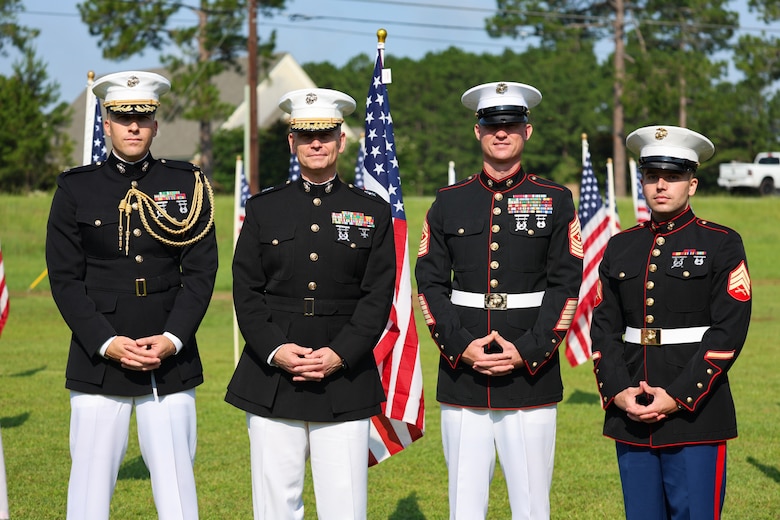 Maj. Gen. Keith D. Reventlow, commanding general, Marine Corps Logistics Command (MARCORLOGCOM), stands with Sgt. Maj. Marshall H. Gregg, senior enlisted advisor, MARCORLOGCOM; Maj. Joshua Ingram, aide-de-camp; and Sgt. Cameron Simpson following the Exchange Club of Lee County’s Field of Honor opening ceremony at the Oakland Library in Leesburg, Georgia, June 26, 2026.