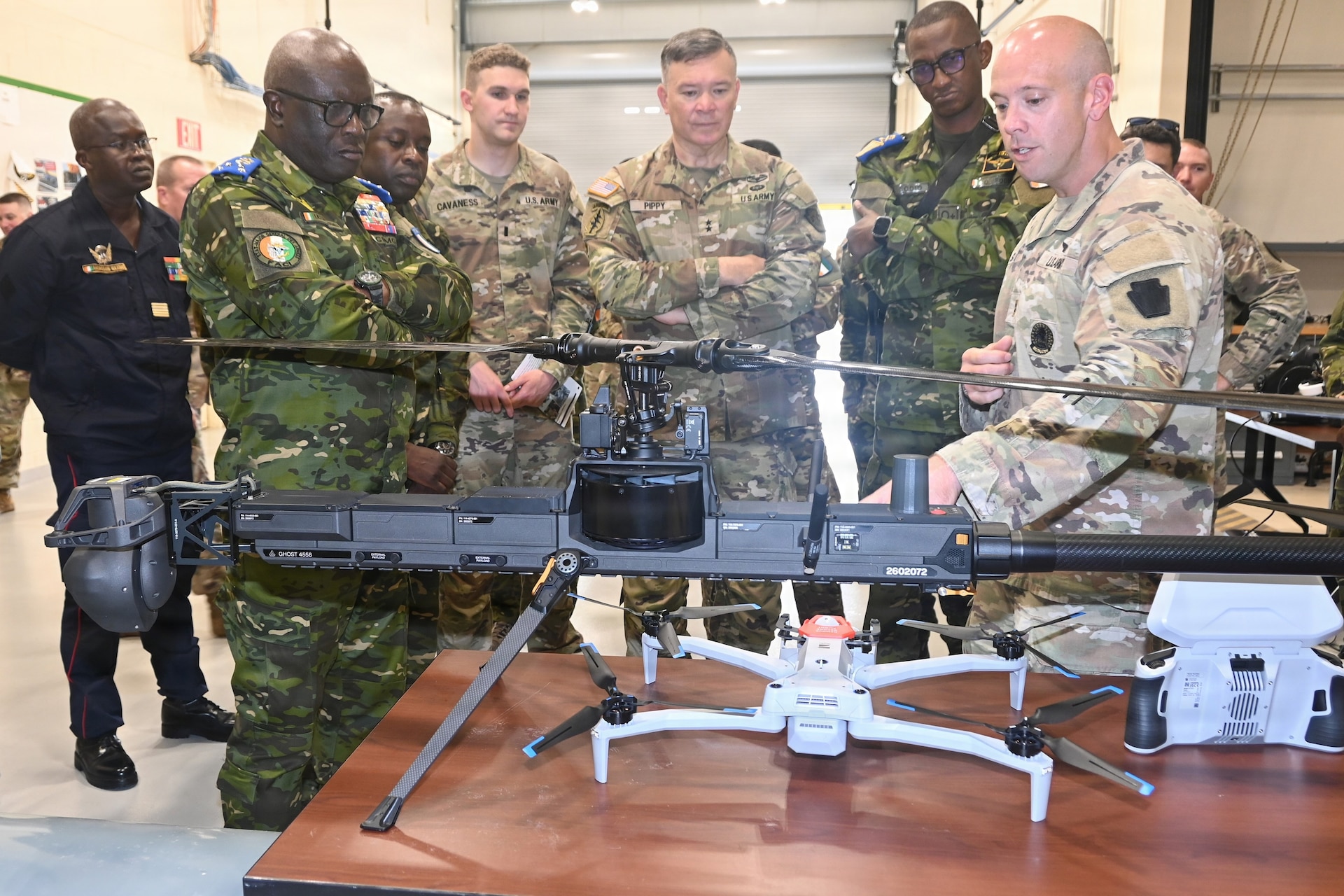 Senior leaders from the Côte d'Ivoire Armed Forces, accompanied by Pennsylvania National Guard leadership, receive a demonstration of capabilities during a tour of multiple facilities at Fort Indiantown Gap, Pennsylvania, June 26, 2026.