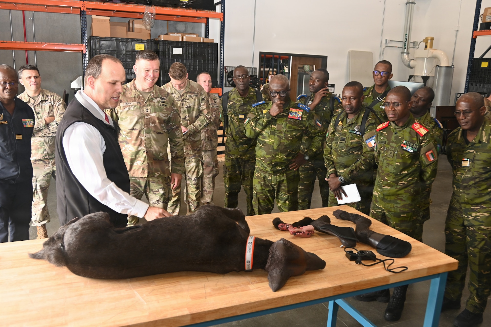 Senior leaders from the Côte d'Ivoire Armed Forces, accompanied by Pennsylvania National Guard leadership, receive a demonstration of capabilities during a tour of multiple facilities at Fort Indiantown Gap, Pennsylvania, June 26, 2026.