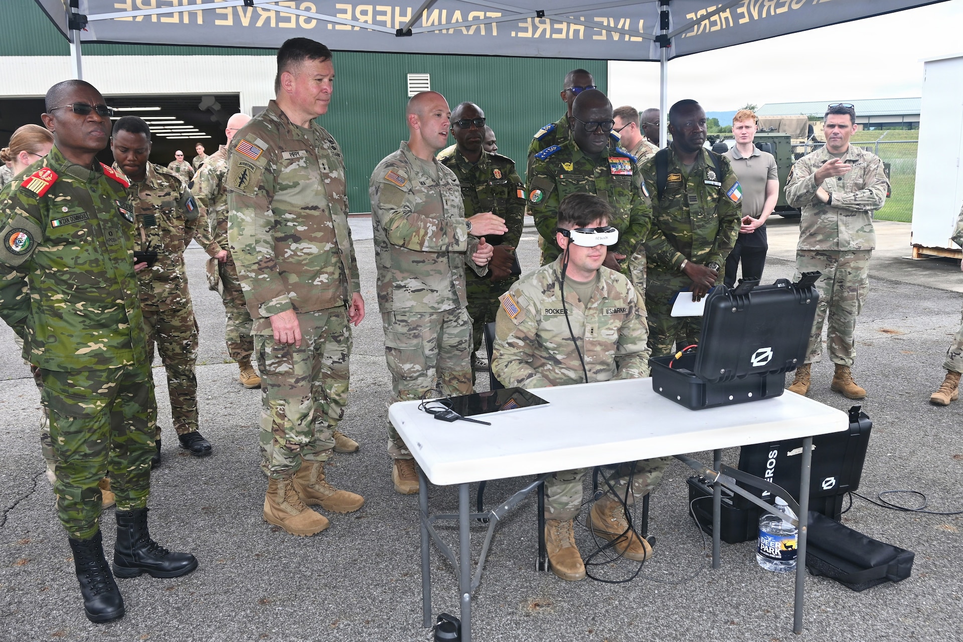 Senior leaders from the Côte d'Ivoire Armed Forces, accompanied by Pennsylvania National Guard leadership, receive a demonstration of capabilities during a tour of multiple facilities at Fort Indiantown Gap, Pennsylvania, June 26, 2026.