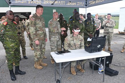 Senior leaders from the Côte d'Ivoire Armed Forces, accompanied by Pennsylvania National Guard leadership, receive a demonstration of capabilities during a tour of multiple facilities at Fort Indiantown Gap, Pennsylvania, June 26, 2026.