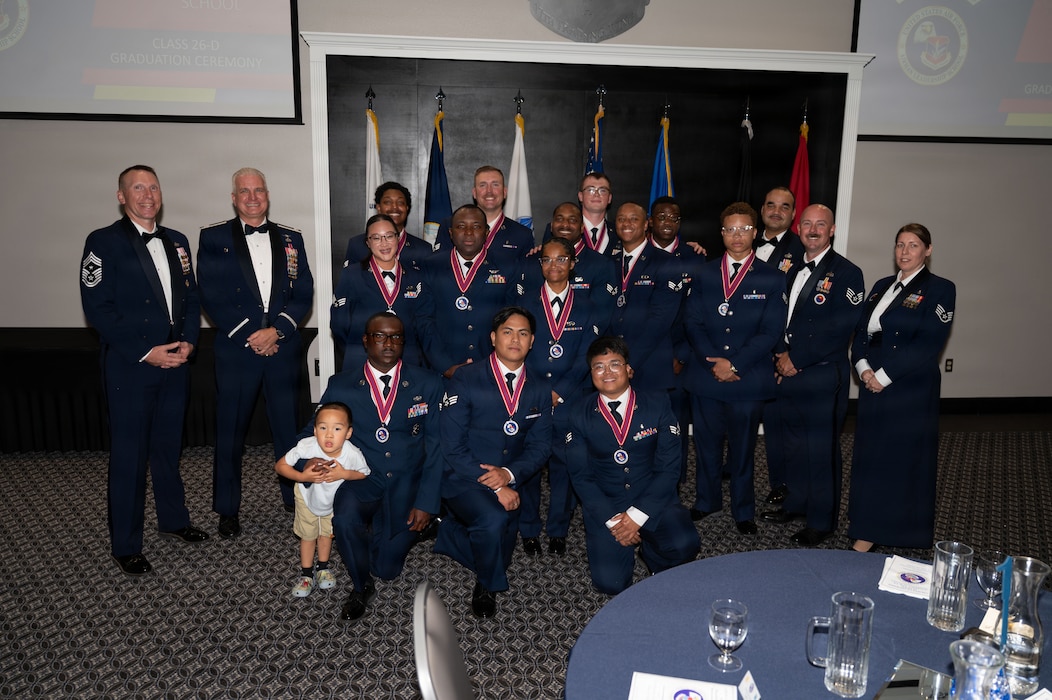Service members pose for a group photo