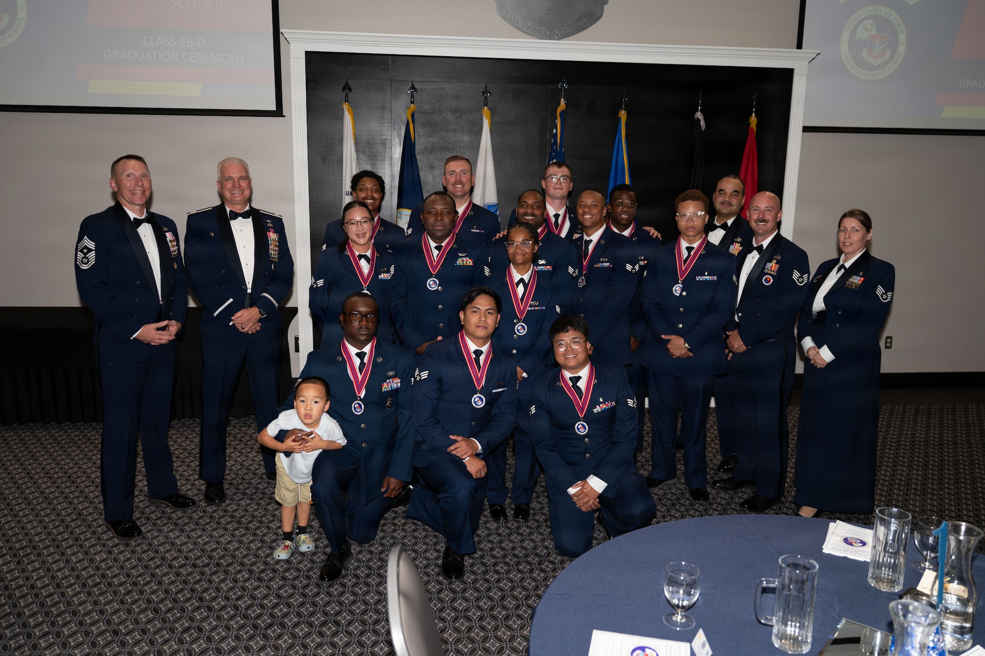 Service members pose for a group photo