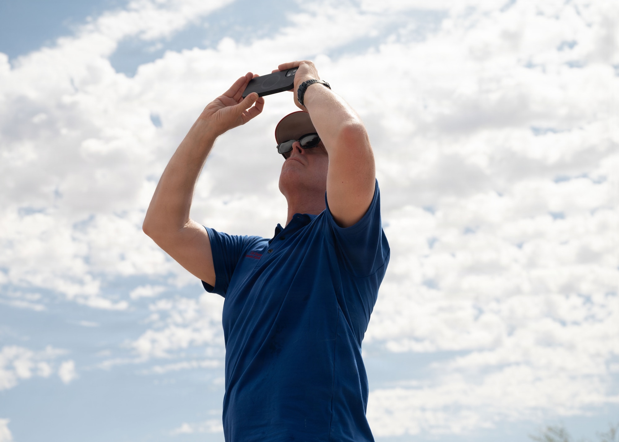 U.S. Air Force Col. Duane Denney, 355th Maintenance Squadron commander, photographs an A-10C Thunderbolt II aircraft at the Barry M. Goldwater Range near Gila Bend, Arizona, June 25, 2026. Davis-Monthan hosted leadership from various squadrons to give an opportunity to showcase the aircraft and mission that many of the Airmen at Davis-Monthan support each and every day. (U.S. Air Force photo by Airman Najzee Kuzu)