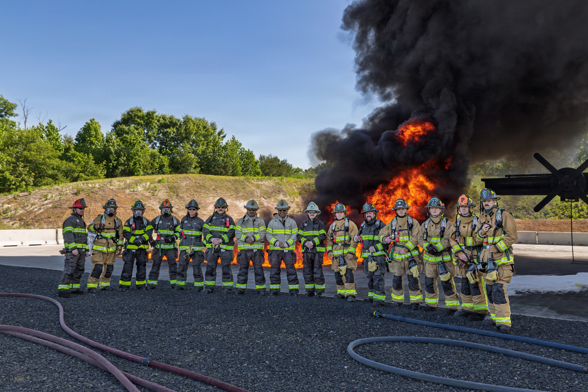 Photo of fire fighters from the Vermont National Guard's 158th Fighter Wing engaging in an aircraft fire during an exercise in New London, North Carolina.