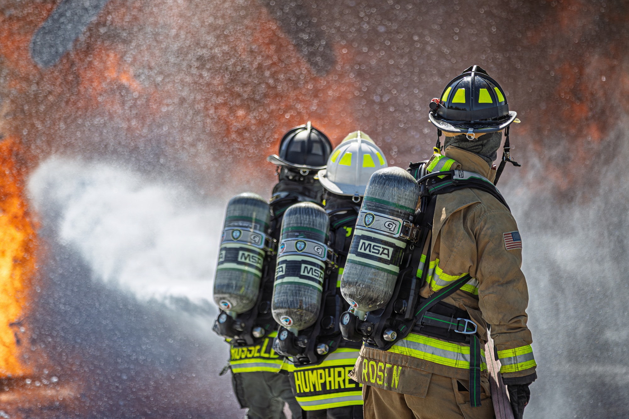 Photo of fire fighters from the Vermont National Guard's 158th Fighter Wing engaging in an aircraft fire during an exercise in New London, North Carolina, May 14, 2026.