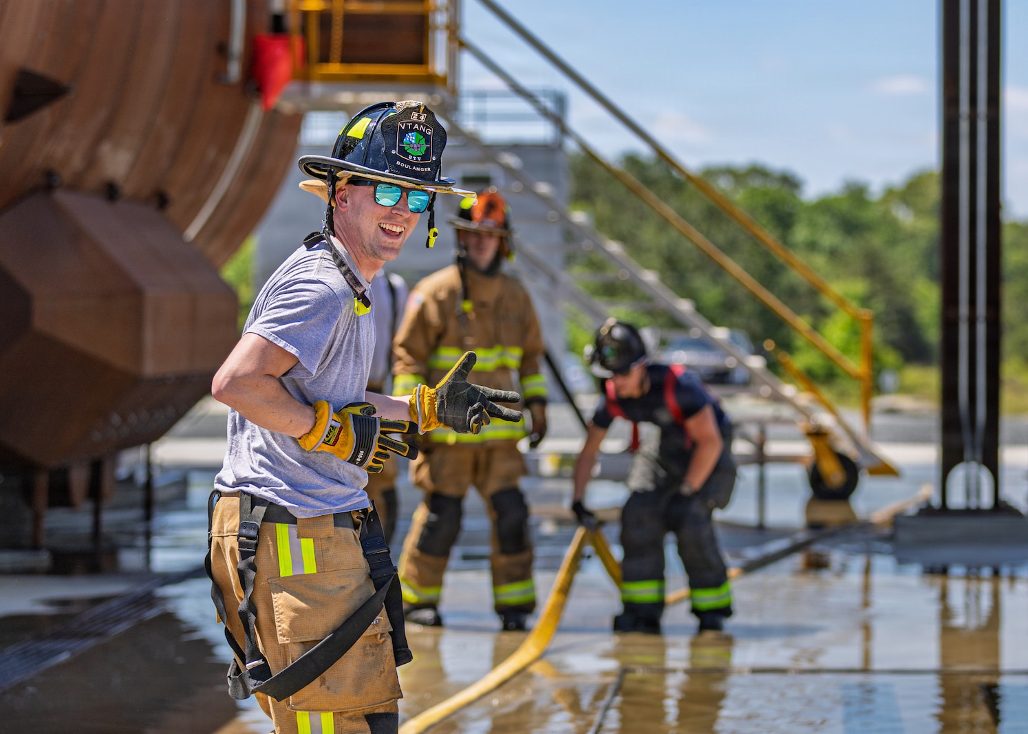 Photo of fire fighters from the Vermont National Guard's 158th Fighter Wing engaging in an aircraft fire during an exercise in New London, North Carolina, May 14, 2026.