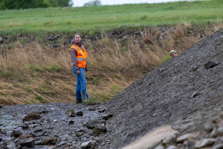 Engineers inspecting creek bank.