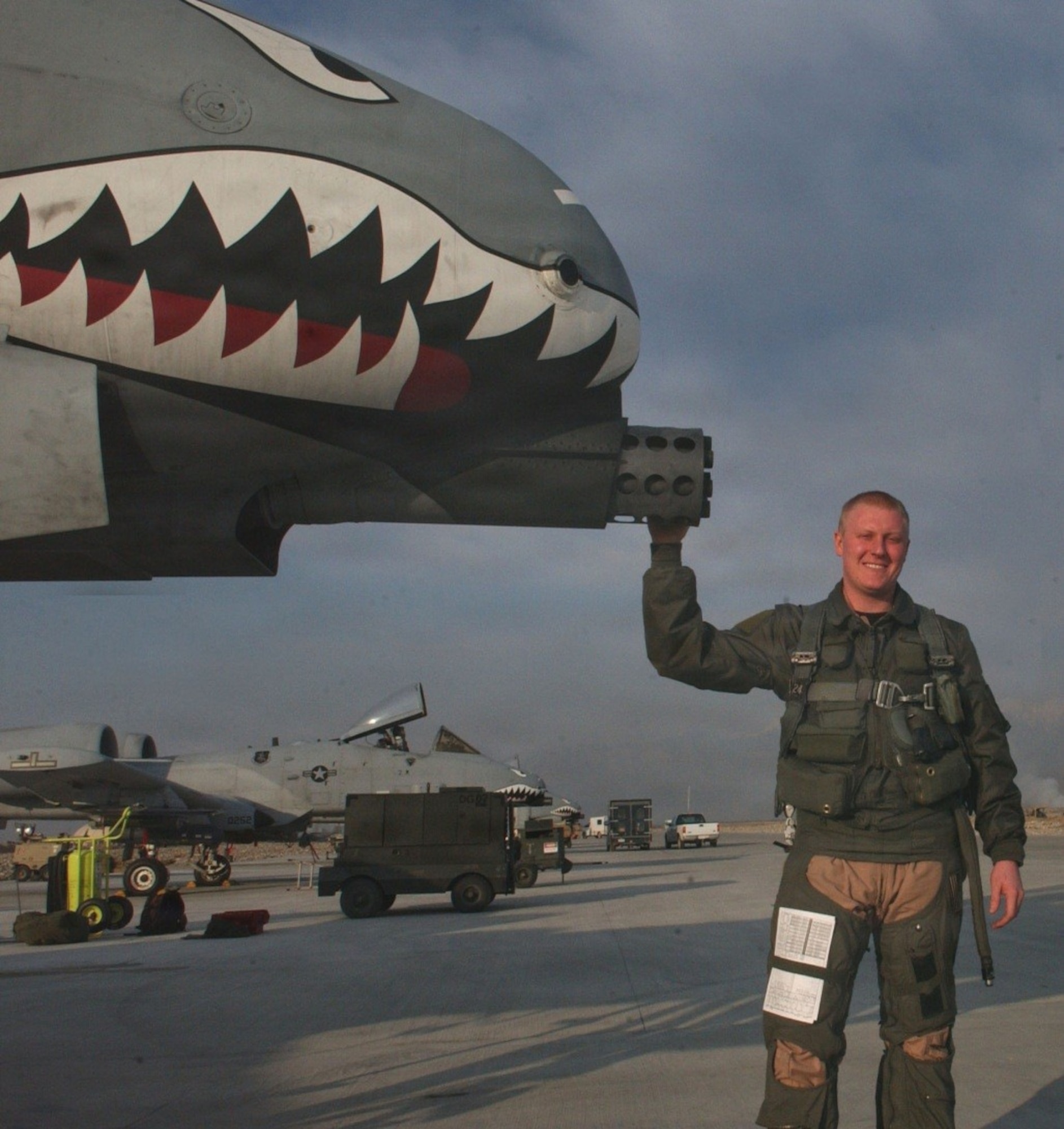 U.S. Air Force Col. John Blocher, A-10 Thunderbolt II pilot, poses with his aircraft prior to a combat sortie at Bagram Air Base, Afghanistan, winter 2005.