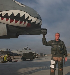 U.S. Air Force Col. John Blocher, A-10 Thunderbolt II pilot, poses with his aircraft prior to a combat sortie at Bagram Air Base, Afghanistan, winter 2005.