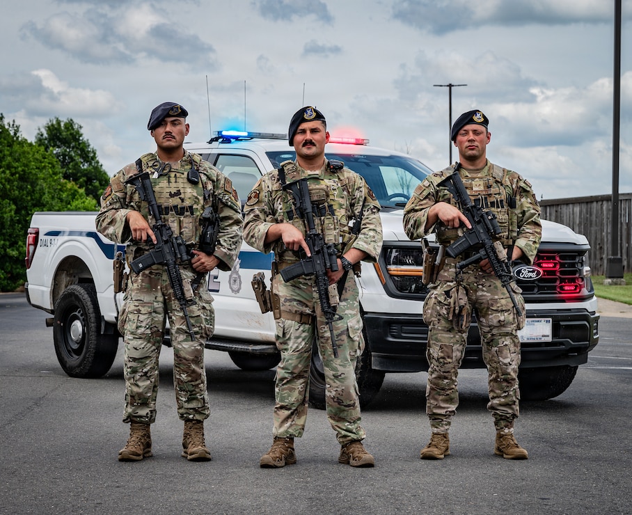 From left: U.S. Air Force Staff Sgt. Joe Jimenez, 2nd Security Forces Squadron certified law enforcement officer, Staff Sgt. Danny Gonzalez, 2nd SFS response force lead, and Staff Sgt. Martin Schortye, 2nd SFS base defense operation center controller, pose for a photo at Barksdale Air Force Base, Louisiana, June 5, 2026. The three defenders received the American Red Cross Lifesaving Award and an Air and Space Achievement Medal for their lifesaving actions following a motorcycle accident. (U.S. Air Force photo by Senior Airman Laiken King) (Portions of this image have been blurred for operational security.)