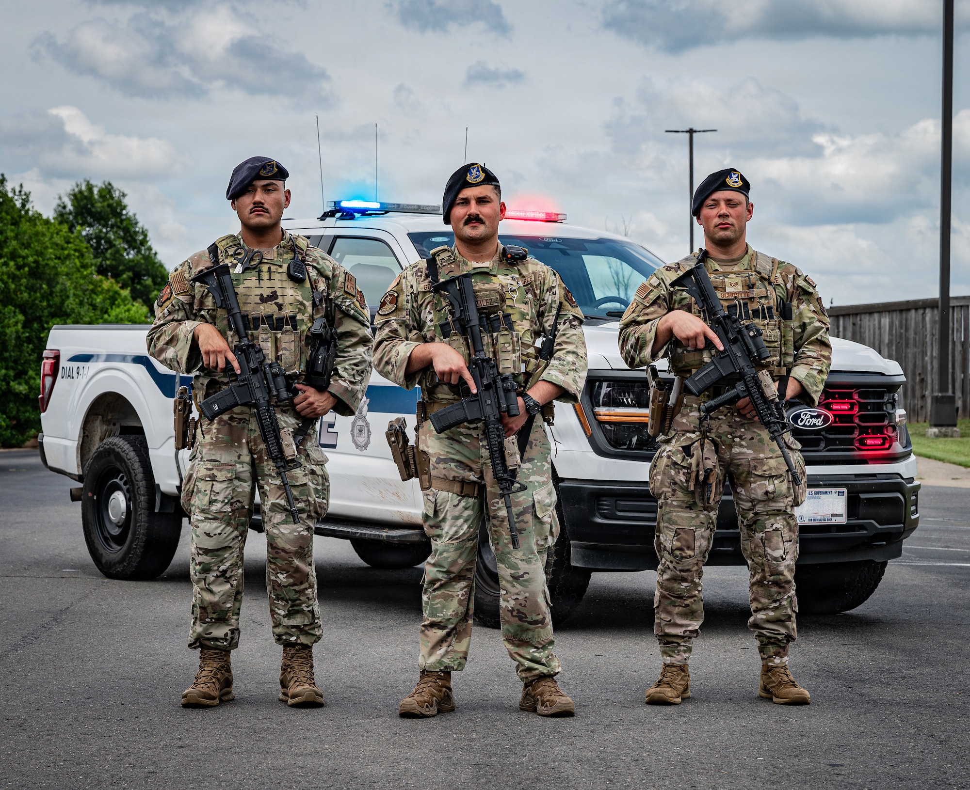 From left: U.S. Air Force Staff Sgt. Joe Jimenez, 2nd Security Forces Squadron certified law enforcement officer, Staff Sgt. Danny Gonzalez, 2nd SFS response force lead, and Staff Sgt. Martin Schortye, 2nd SFS base defense operation center controller, pose for a photo at Barksdale Air Force Base, Louisiana, June 5, 2026. The three defenders received the American Red Cross Lifesaving Award and an Air and Space Achievement Medal for their lifesaving actions following a motorcycle accident. (U.S. Air Force photo by Senior Airman Laiken King) (Portions of this image have been blurred for operational security.)