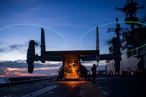 A U.S. Marine Corps MV-22B Osprey, assigned to Marine Medium Tiltrotor Squadron (VMM) 163 (Reinforced), 11th Marine Expeditionary Unit (MEU), sits on the flight deck of Wasp-class amphibious assault ship USS Boxer (LHD 4) during flight quarters, June 21, 2026.