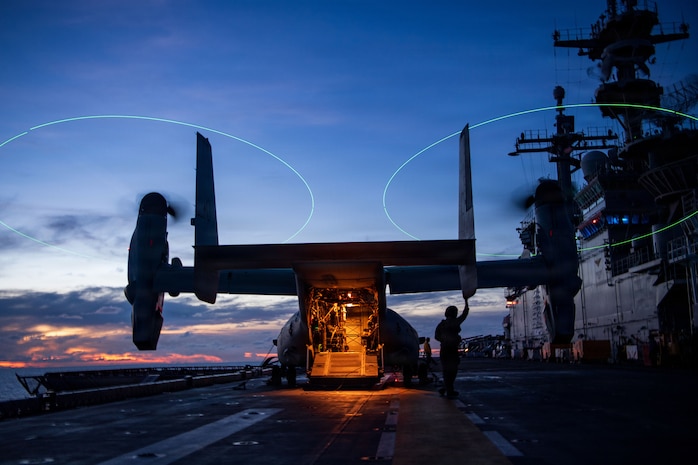 A U.S. Marine Corps MV-22B Osprey, assigned to Marine Medium Tiltrotor Squadron (VMM) 163 (Reinforced), 11th Marine Expeditionary Unit (MEU), sits on the flight deck of Wasp-class amphibious assault ship USS Boxer (LHD 4) during flight quarters, June 21, 2026.