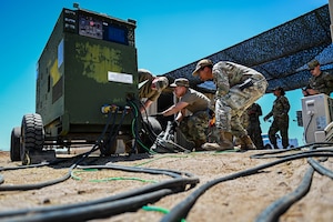 U.S. Air Force Airmen assigned to the 56th Civil Engineer Squadron work together to establish a stable source of electricity during a Prime Base Engineer Emergency Force exercise.