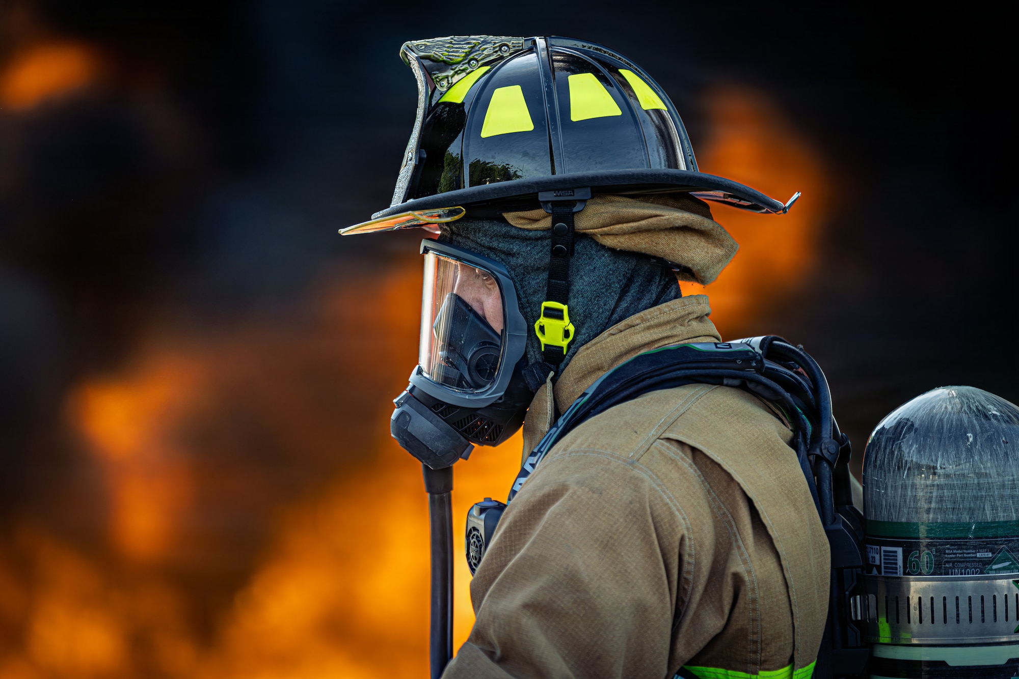 Photo of fire fighters from the Vermont National Guard's 158th Fighter Wing engaging in an aircraft fire during an exercise in New London, North Carolina.