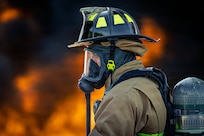 Photo of fire fighters from the Vermont National Guard's 158th Fighter Wing engaging in an aircraft fire during an exercise in New London, North Carolina.