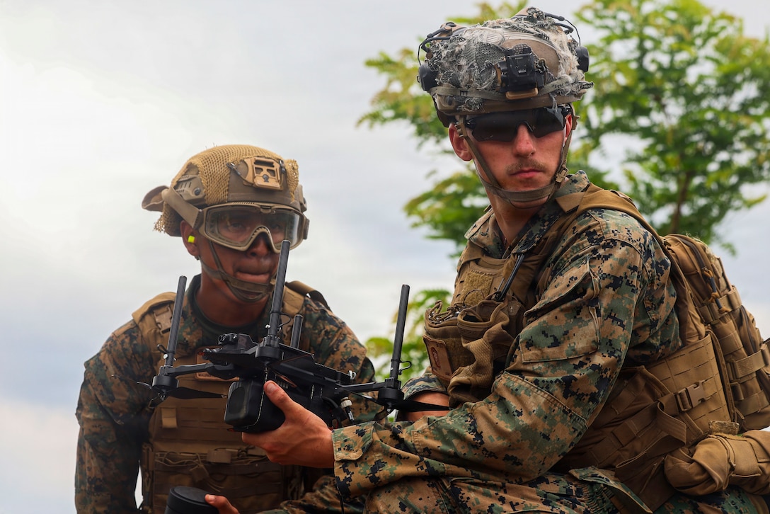 From left, U.S. Marine Corps Lance Cpl. Adriano Malpartida, a small unmanned aerial systems operator, and Lance Cpl. Dayton Nooner, a combat engineer, both assigned to 3rd Littoral Combat Team, 3rd Marine Littoral Regiment, 3rd Marine Division, prepare a Neros Archer striker variant drone for a live-fire range at Fort Magsaysay, Nueva Ecija, Philippines, June 3, 2026.