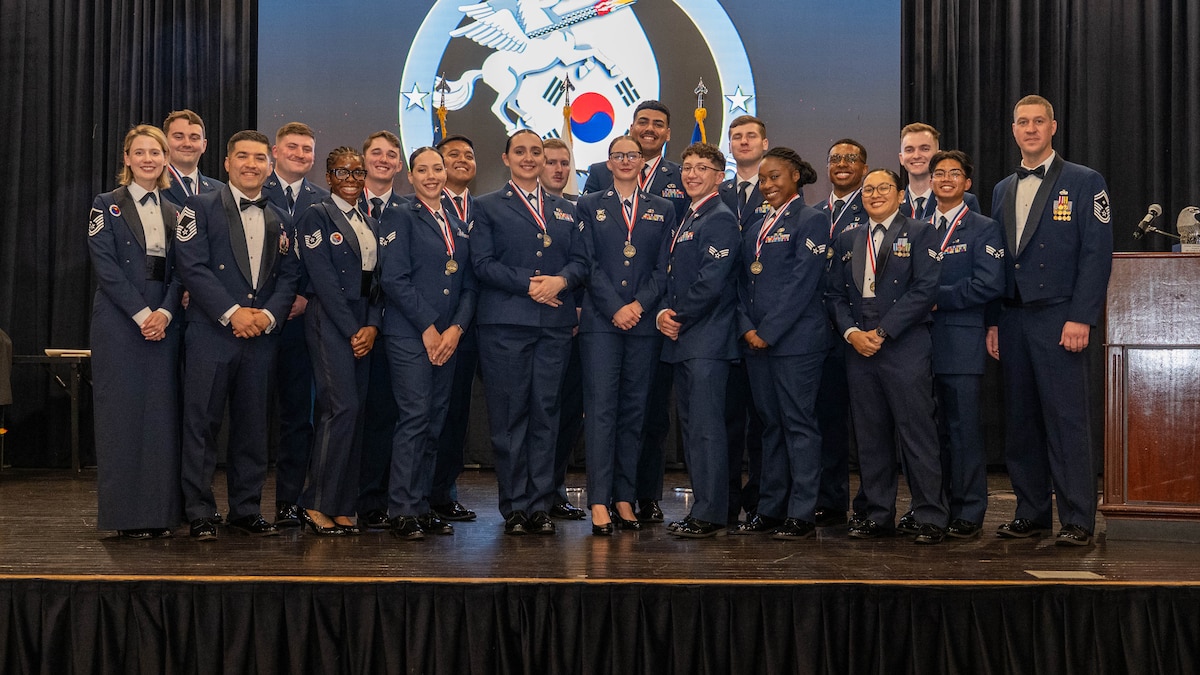 Airman Leadership School graduates, instructors and mentors pose for a group photo following a graduation ceremony at Osan Air Base, Republic of Korea, June 25, 2026. ALS prepares Airmen to become effective frontline supervisors by developing leadership, communication and mission focused decision making skills. (U.S. Air Force photo by Senior Airman Megan Cusmano)