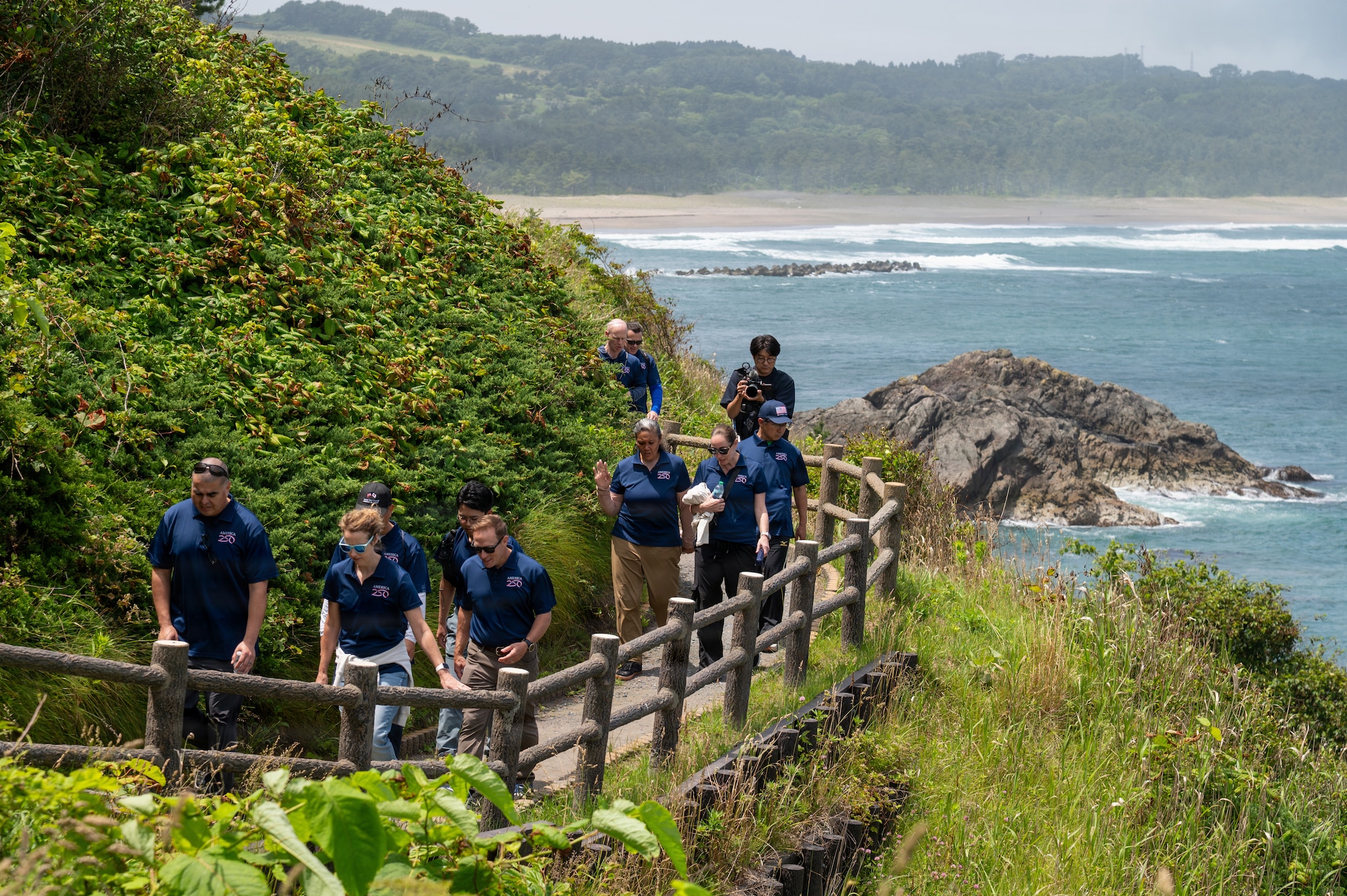 Participants of a “Friendship Hike” walk along the trail overlooking the Pacific Ocean at Hachinohe, Japan, June 20, 2026.