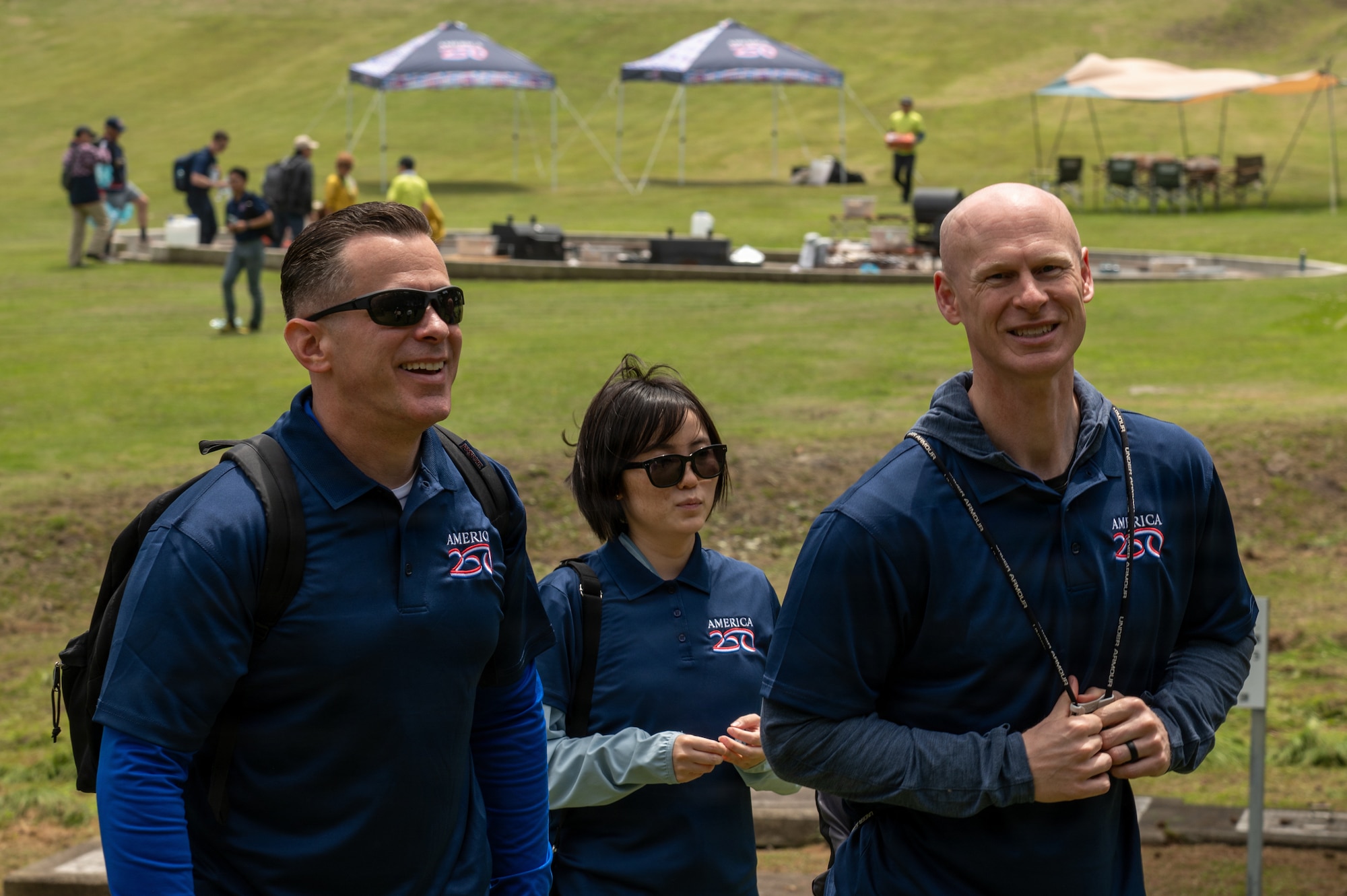 U.S. Air Force Chief Master Sgt. Robert Kuhn, 35th Mission Support Group senior enlisted leader, left, a local participant, middle, and Chief Master Sgt. Leonard Myers, 35th Medical Group senior enlisted leader, right, get ready to start their hike on the Tanesashi Coastal trail at Hachinohe, Japan, June 20, 2026.