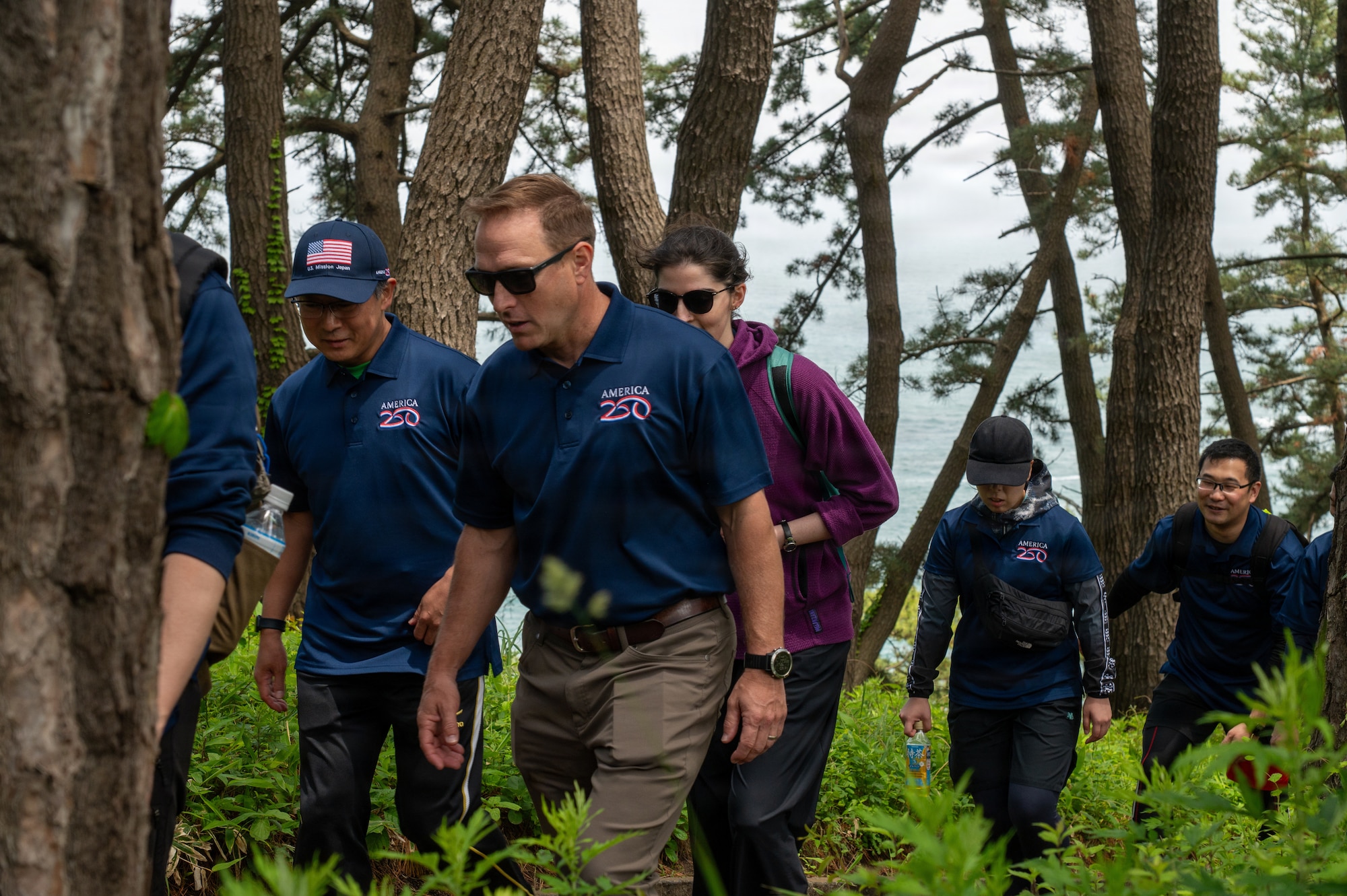 U.S. Embassy Deputy Chief of Mission, Aaron D. Snipe, poses for a group photo with 35th Fighter Wing leadership, Japan Air Self-Defense Forces leadership and local government officials participate in a “Friendship Hike” along the Tanesashi Coast trail at Hachinohe, Japan, June 20, 2026.