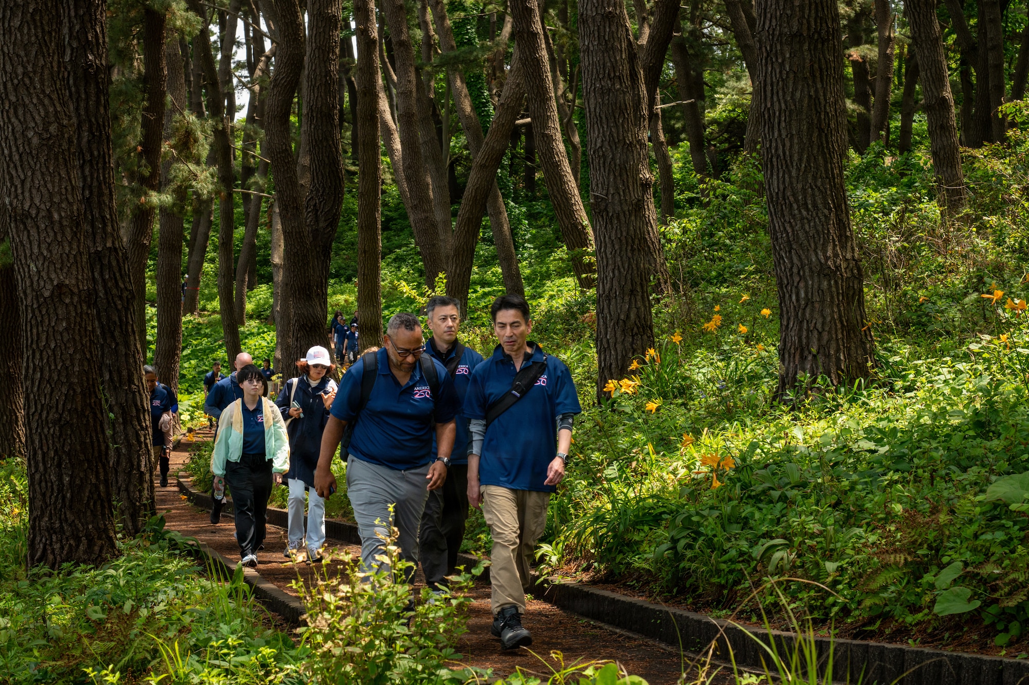 Members of the U.S. diplomatic corps and Misawa Air Base leaders hike along the Tanesashi Coast at Hachinohe, Japan, June 20, 2026.