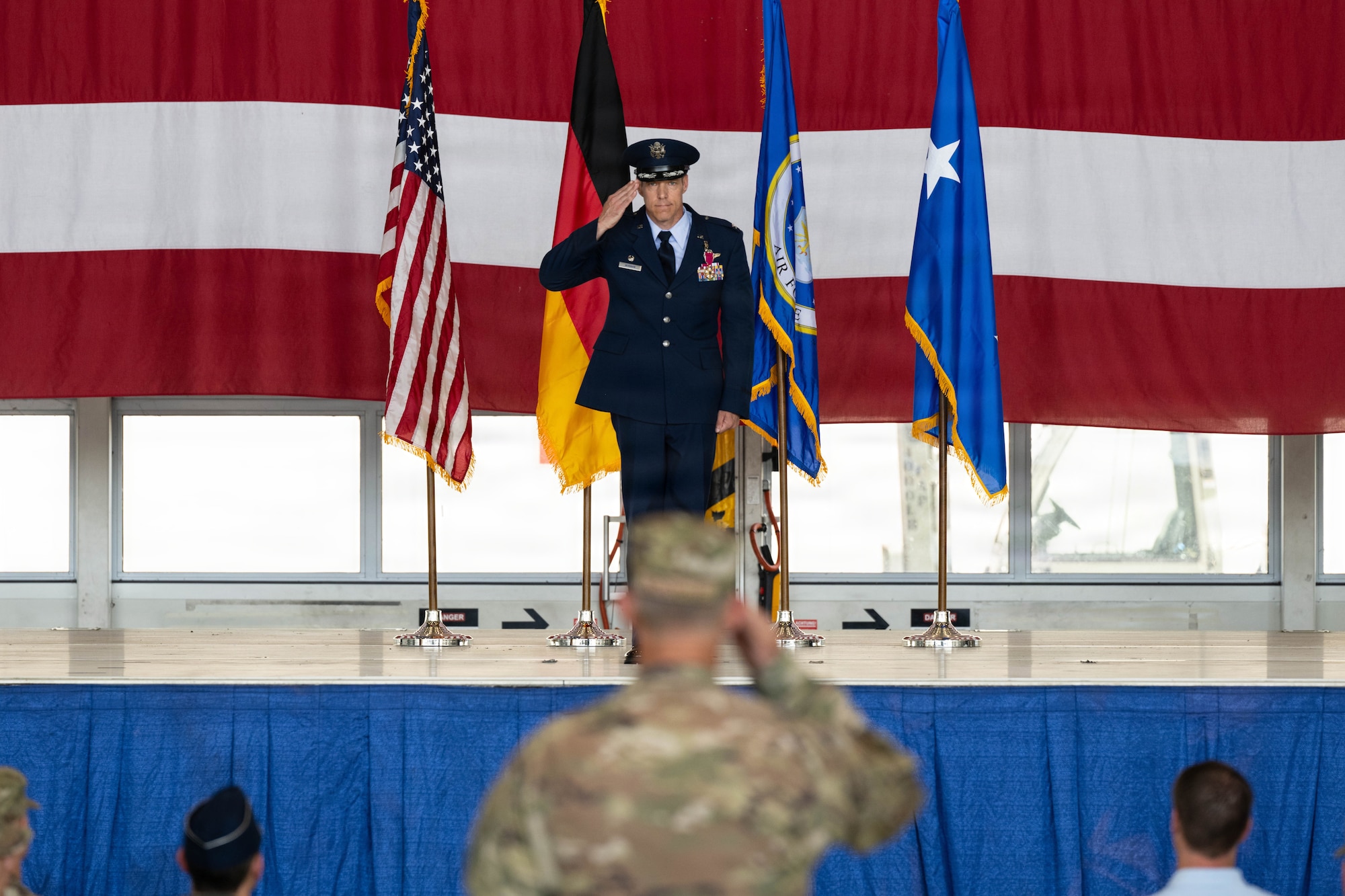 Previous commander salutes 521st AMOW Airmen during change of command.