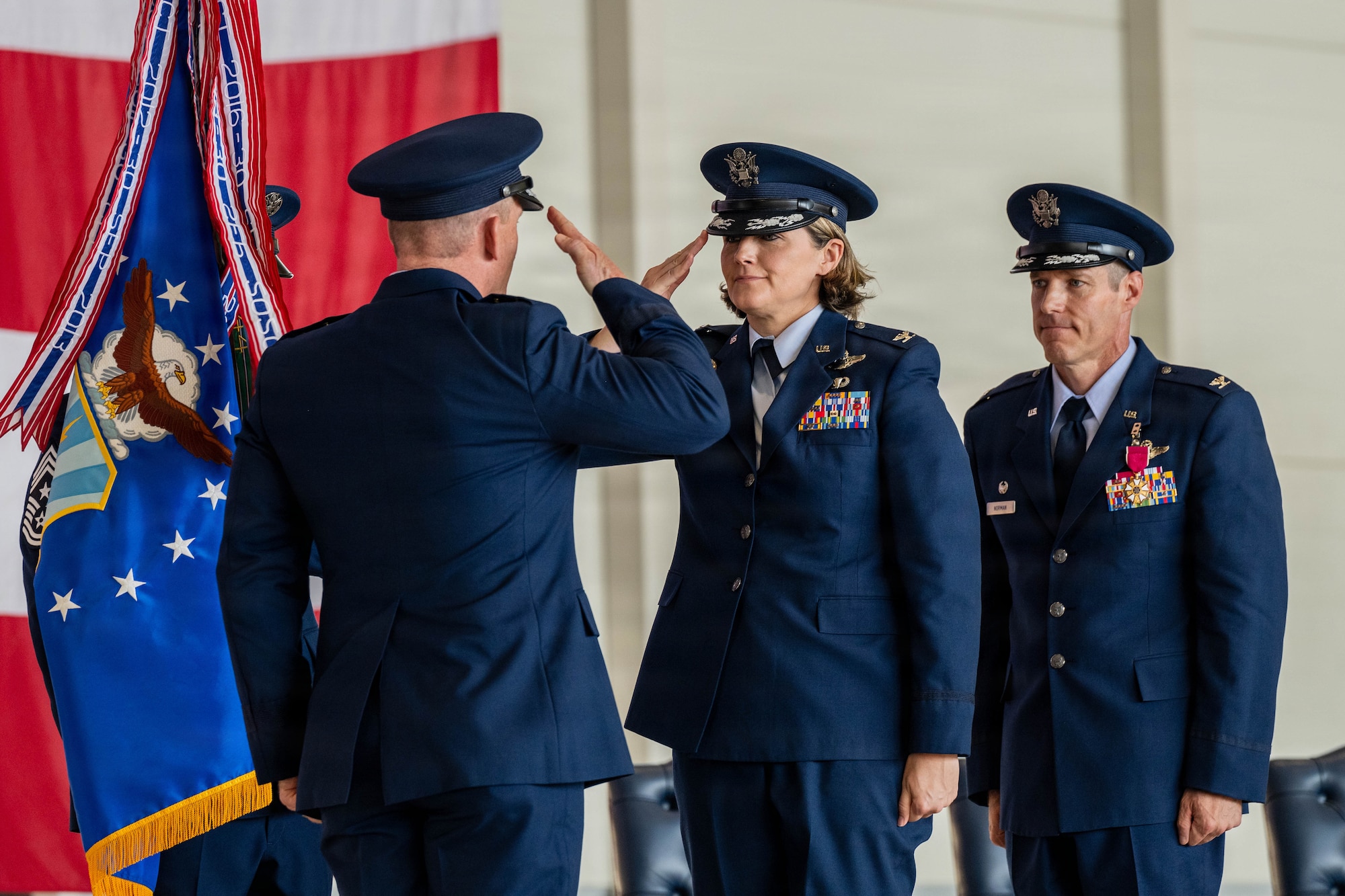 New and old commander salute one another.