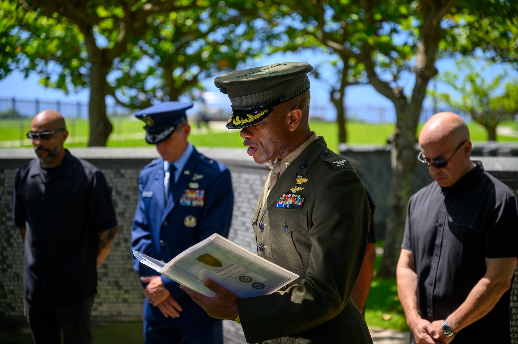 U.S. Navy Capt. Robert Peters, chaplain of III Marine Expeditionary Force, delivers an invocation during the Okinawa Memorial Day ceremony at “The Cornerstone of Peace” in Peace Memorial Park, Okinawa, Japan, June 23, 2026. The annual ceremony, hosted by the American Chamber of Commerce in Okinawa and USO Okinawa, commemorates the end of the Battle of Okinawa and honors those who lost their lives during the conflict. (U.S. Air Force photo by Airman 1st Class Francisco Huerta)