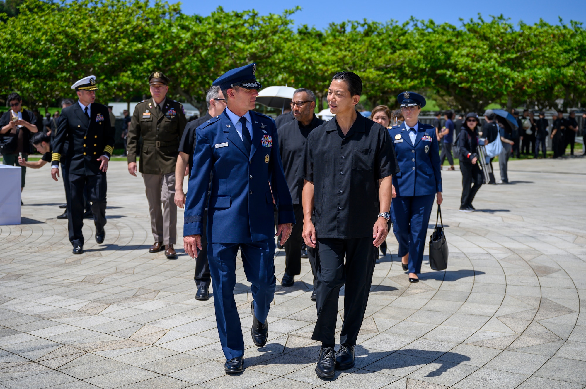 U.S. Air Force Brig. Gen. John Gallemore, 18th Wing commander, left, walks alongside Andrew Ou, U.S. consul general in Okinawa, following the Okinawa Memorial Day ceremony at “The Cornerstone of Peace” in Peace Memorial Park, Okinawa, Japan, June 23, 2026. The ceremony, hosted annually by the American Chamber of Commerce in Okinawa and USO Okinawa, commemorates the end of the Battle of Okinawa and honors those who lost their lives during the conflict. (U.S. Air Force photo by Airman 1st Class Francisco Huerta)